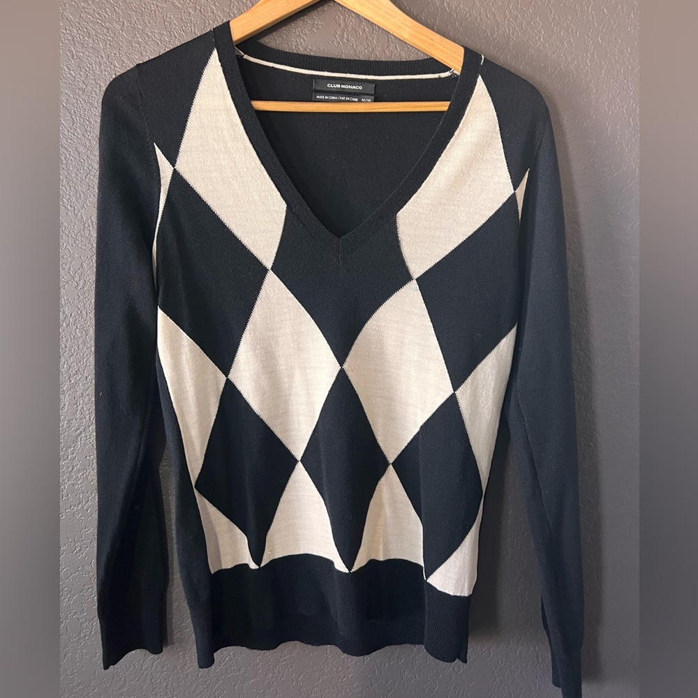 Club Monaco woman’s black and white v neck sweater.